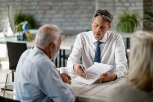 Client learning from real estate agent the important lesson of how to price your home.