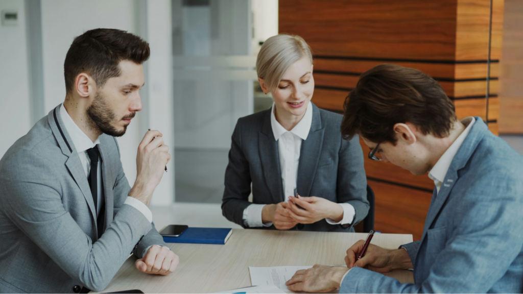 Having the clear and professional guidance that Bonner Realty agents like Candice, pictured here with clients, provide allows you to move forward with confidence.