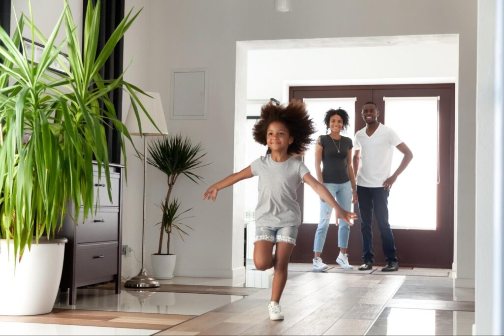 A family excited to enjoy their new home attained by the aid of excellent real estate agents.