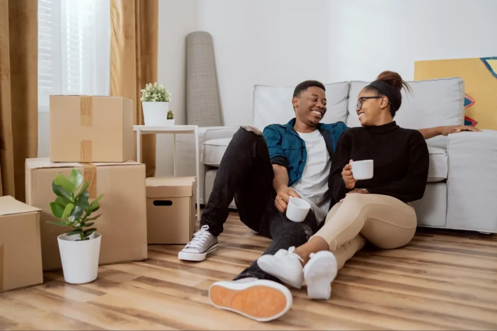 This couple is relaxing the morning after their move because they had a solid moving house checklist.